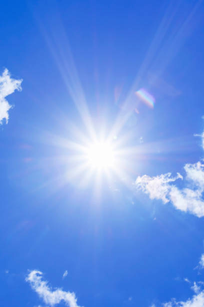 istock Bright sun with beautiful beams in the sky with light clouds 1322254487