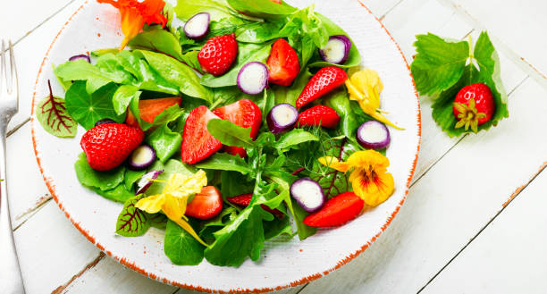 istock Summer salad with berries and green 1322257356