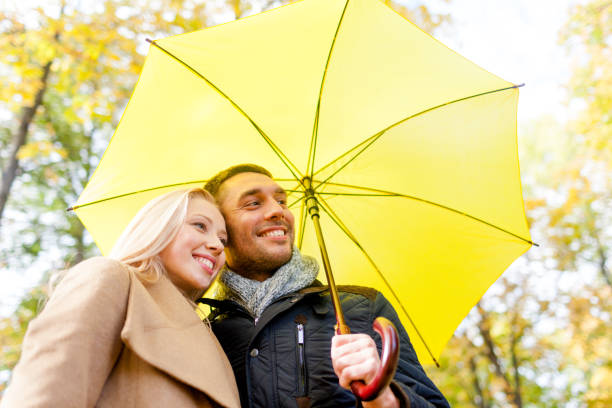 istock smiling couple hugging in autumn park 1322259330