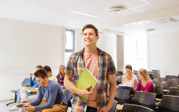 istock group of smiling students in lecture hall 1322260044