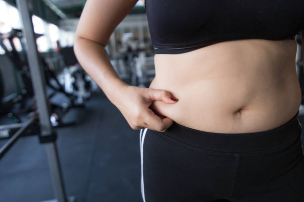 istock A woman body with fat belly. 1322262179