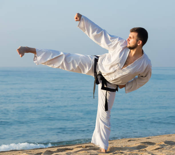 istock guy demonstrates aikido poses at seaside 1322263509