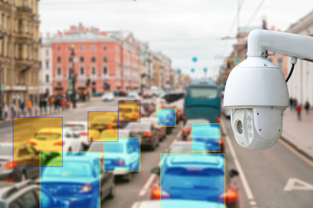 istock The concept of video surveillance and security technologies. Surveillance camera on the background of the city road with cars 1322266990