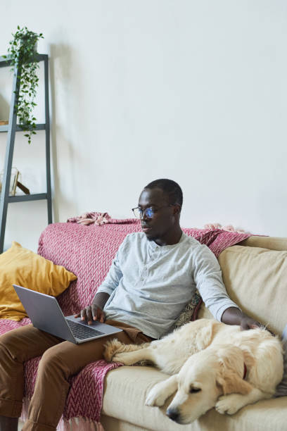 istock Man with laptop at home 1322269086