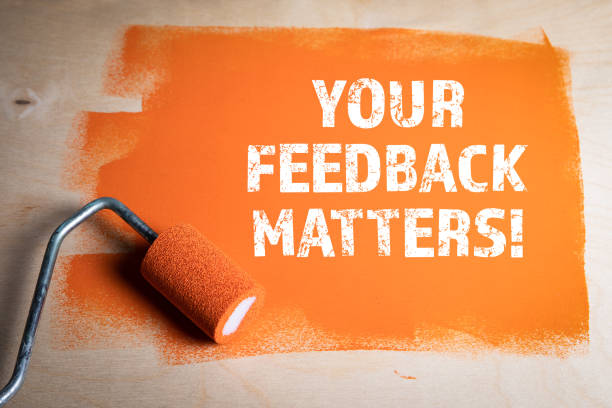 YOUR FEEDBACK MATTERS. Orange painted wooden surface