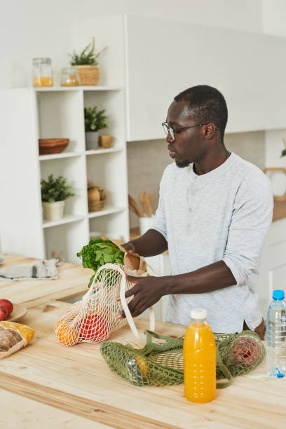 istock Man preparing food for dinner 1322270222