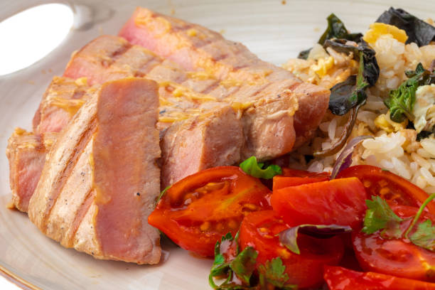 istock Grilled pork chop and rice with sauce 1322270381