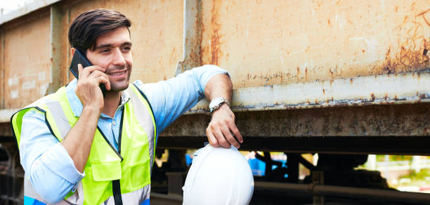 istock An engineer stands talk on the phone at the job site. 1322270413