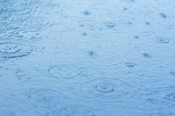 istock Rain drops in the water 1322271344