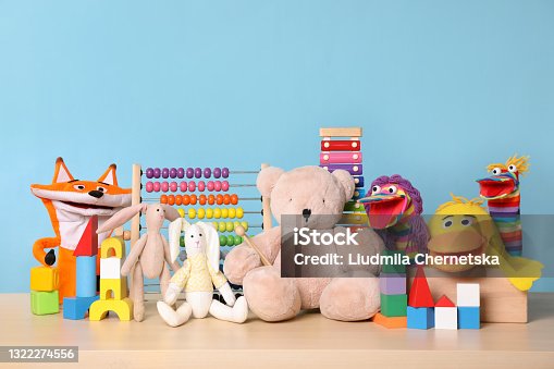 istock Collection of different toys on wooden table 1322274556