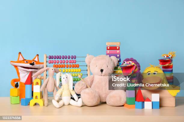 Collection Of Different Toys On Wooden Table Stock Photo - Download Image Now - Toy, Collection, New