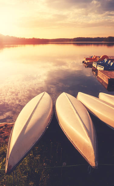 istock Kayaks by a lake at sunset. 1322275480