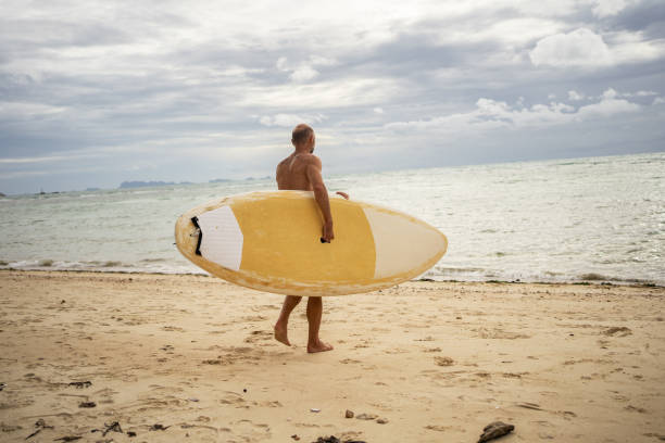 istock Senior man enjoying summer activities 1322275835