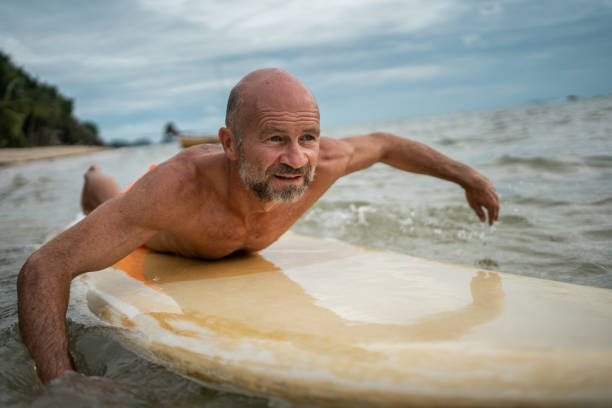 istock Senior man enjoying summer activities 1322275851