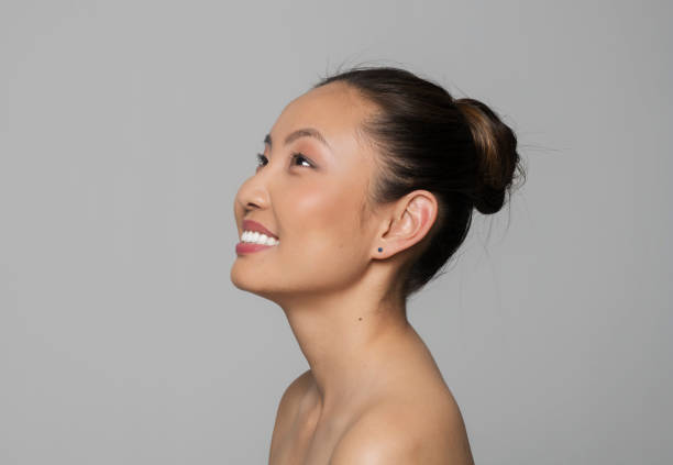 istock Side view of smiling young woman 1322277580