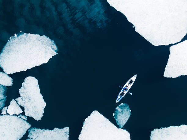 istock Kayak sailing between ice floes 1322277634