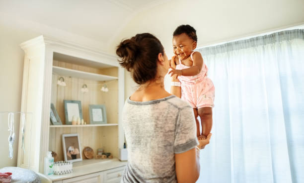 istock Mother and daughter having fun at home 1322278921