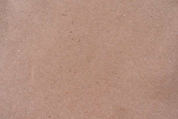 istock Blank, brown cardboard sheet paper, craft abstract background 1322279404