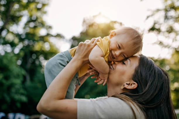 istock Mother playing with her baby 1322280323