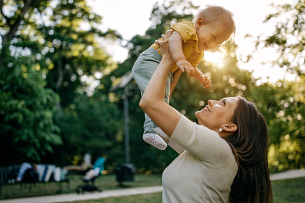 istock Mother playing with her baby 1322280351