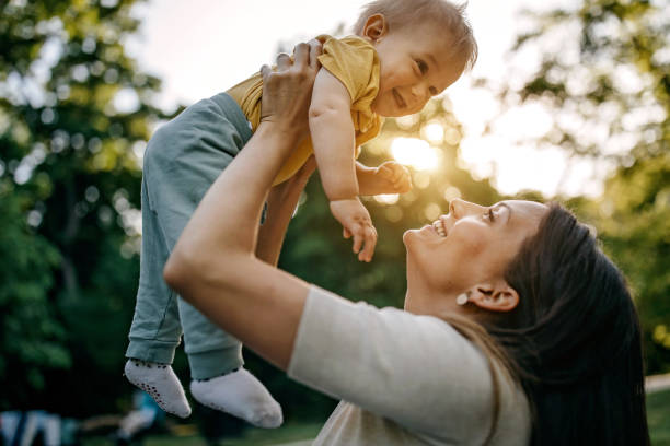 istock Mother playing with her baby 1322280374