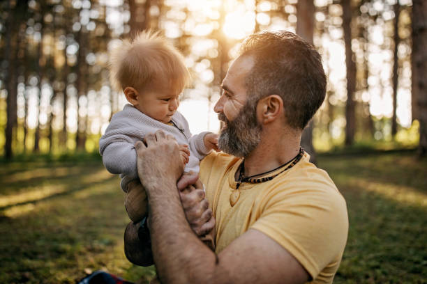istock Father playing with baby 1322280872