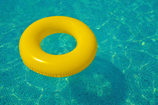 istock Colorful tube floating in a swimming pool 1322280970