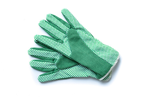 Overhead view of a pair of green garden gloves isolated on white background.