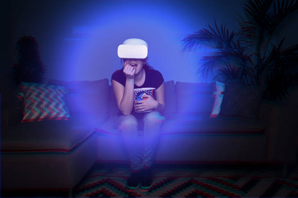 istock Woman watching movie at home using vr headset 1322282544