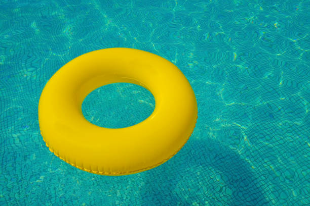 istock Colorful tube floating in a swimming pool 1322283087