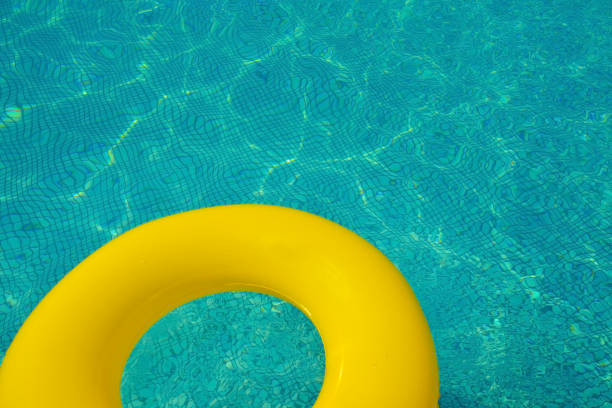 istock Colorful tube floating in a swimming pool 1322284097