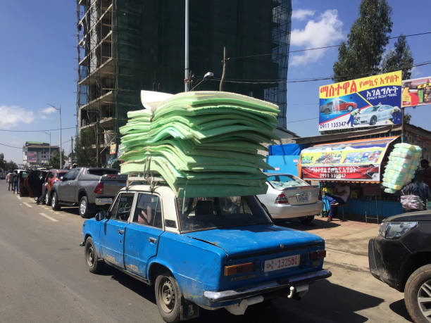 3 March 2019 - Addis Ababa, Ethiopia : Taxi, laden high with mattresses driving through Addis Ababa