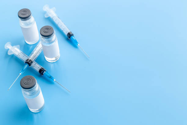 istock Vaccine vial bottle for injection. Vaccination concept 1322289583