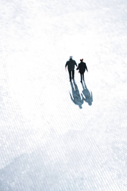 istock people shadows silhouette on the street 1322291162
