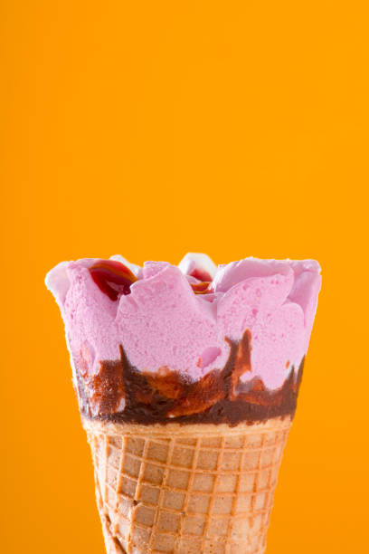 istock strawberry and chocolate ice cream cone 1322292210
