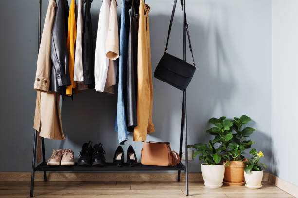 istock basic women's autumn wardrobe with shoes and handbags on  hanger 1322292372