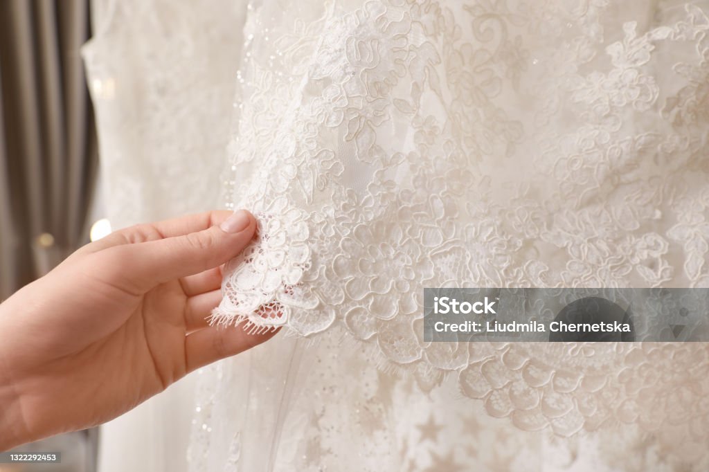 Young woman choosing wedding dress in salon, closeup Wedding Dress Stock Photo