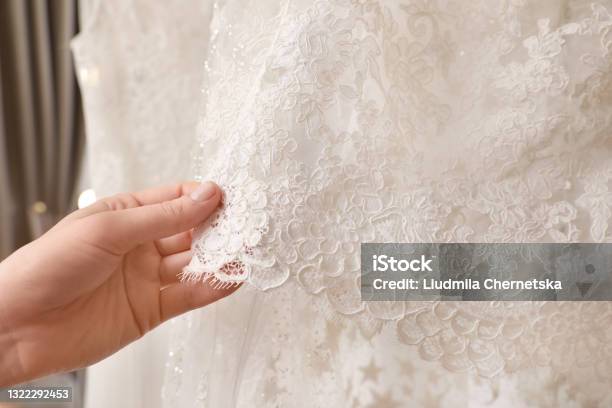 Young Woman Choosing Wedding Dress In Salon Closeup Stock Photo - Download Image Now