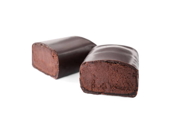 istock Delicious cut glazed cheese with cocoa on white background 1322293564