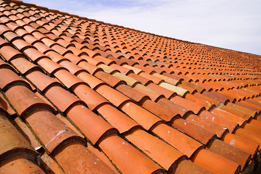 red roof tiles closeup real with sky background