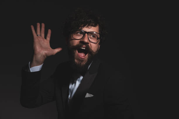 istock young handsome businessman screaming and fooling around 1322294544
