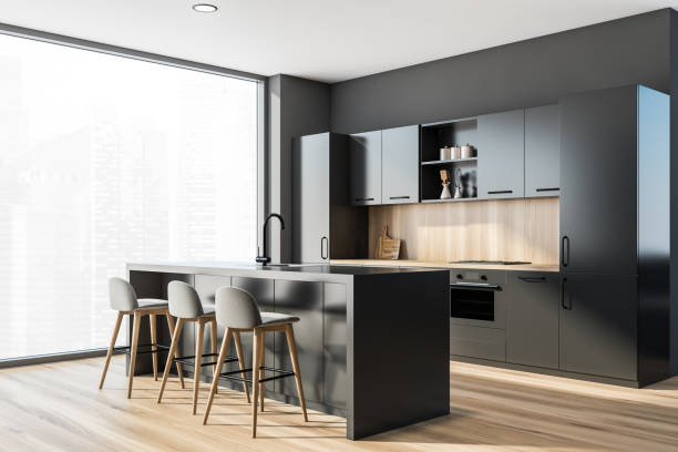 istock Bar with stools in grey and wooden kitchen corner with window 1322295233