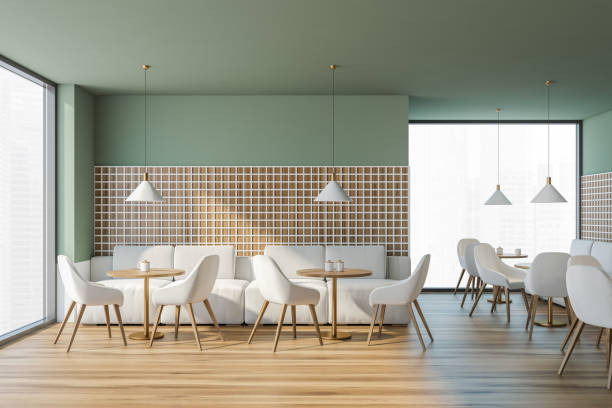 istock Modern cafe interior with wooden table and chairs, panoramic windows 1322295681