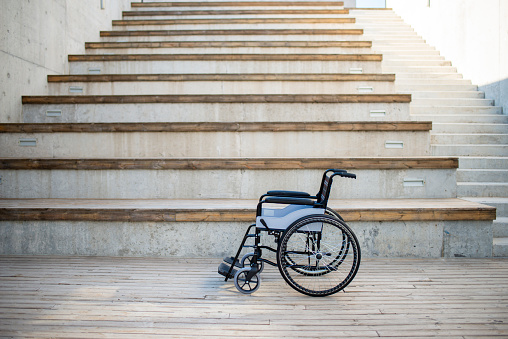 December 3 is International Day of Persons with Disabilities.\nwheelchair standing across obstacles. Empty wheelchairs and stairs in campus and workplace
