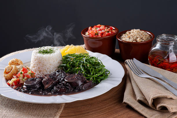 istock Typical dish of Brazilian cuisine called Feijoada, with black beans, bacon, sausage and pork 1322298501