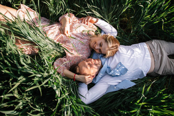 Happy young couple portrait from above, hugs, date. Happy hormonal relationship concept Photo of Happy young couple portrait from above, hugs, date. Happy hormonal relationship concept falling in love photos stock pictures, royalty-free photos & images