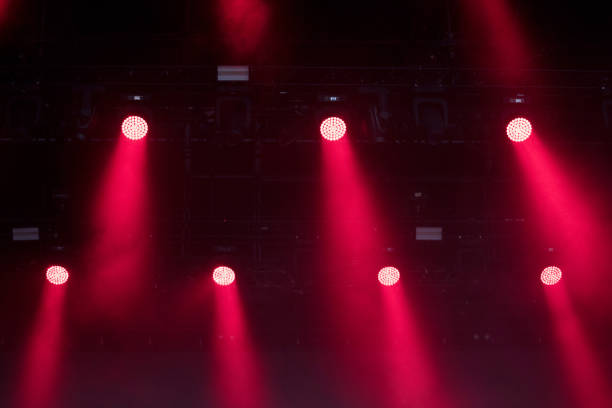 istock Red stage lights glowing in the dark 1322298840