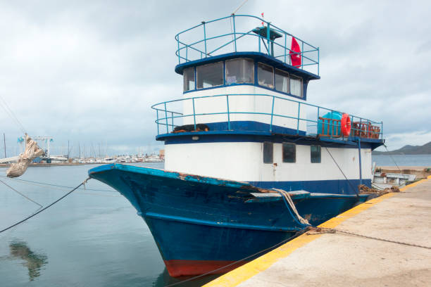 istock Fishing boat moored in harbor 1322299814
