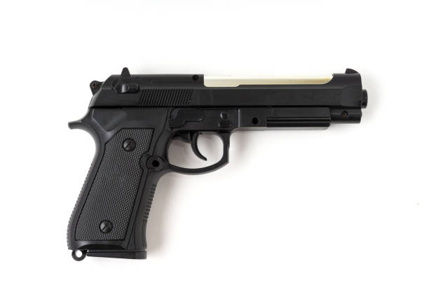 istock A pistol gun isolated on white background. 1322301272