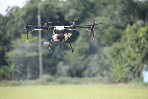 istock Drone spraying insecticide in flight. 1322301496